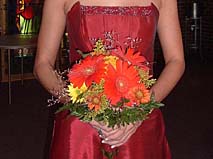 Gerbera daisies in a bridesmaid's bouquet